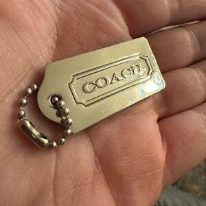 Silver metal coach hangtag